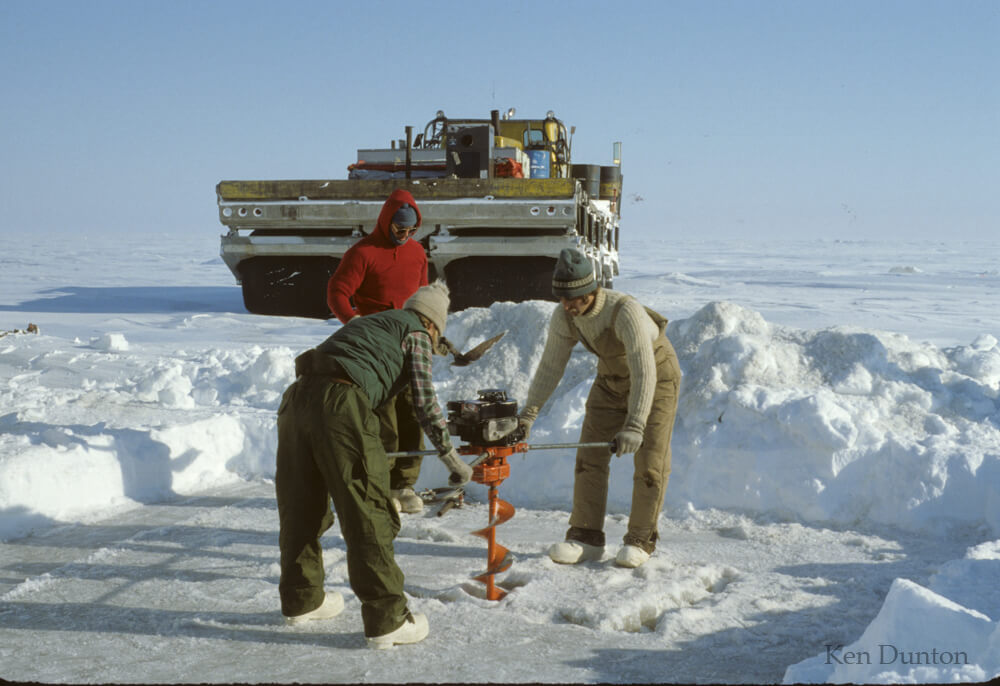 Susan Schonberg and Ken Dunton begin drilling the dive hole, April 1979